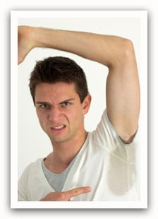 young male adult showing heavily sweaty armpit region