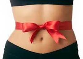 Woman with ribbon wrapped around stomach