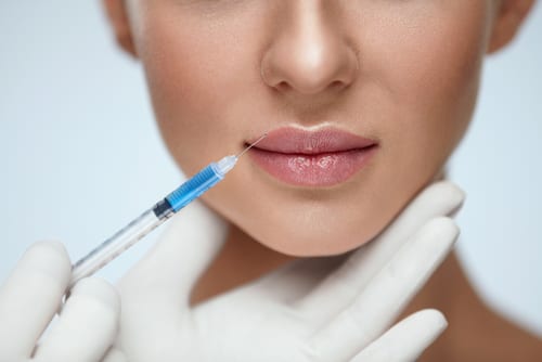 Close Up Of Woman Getting Lip Injection