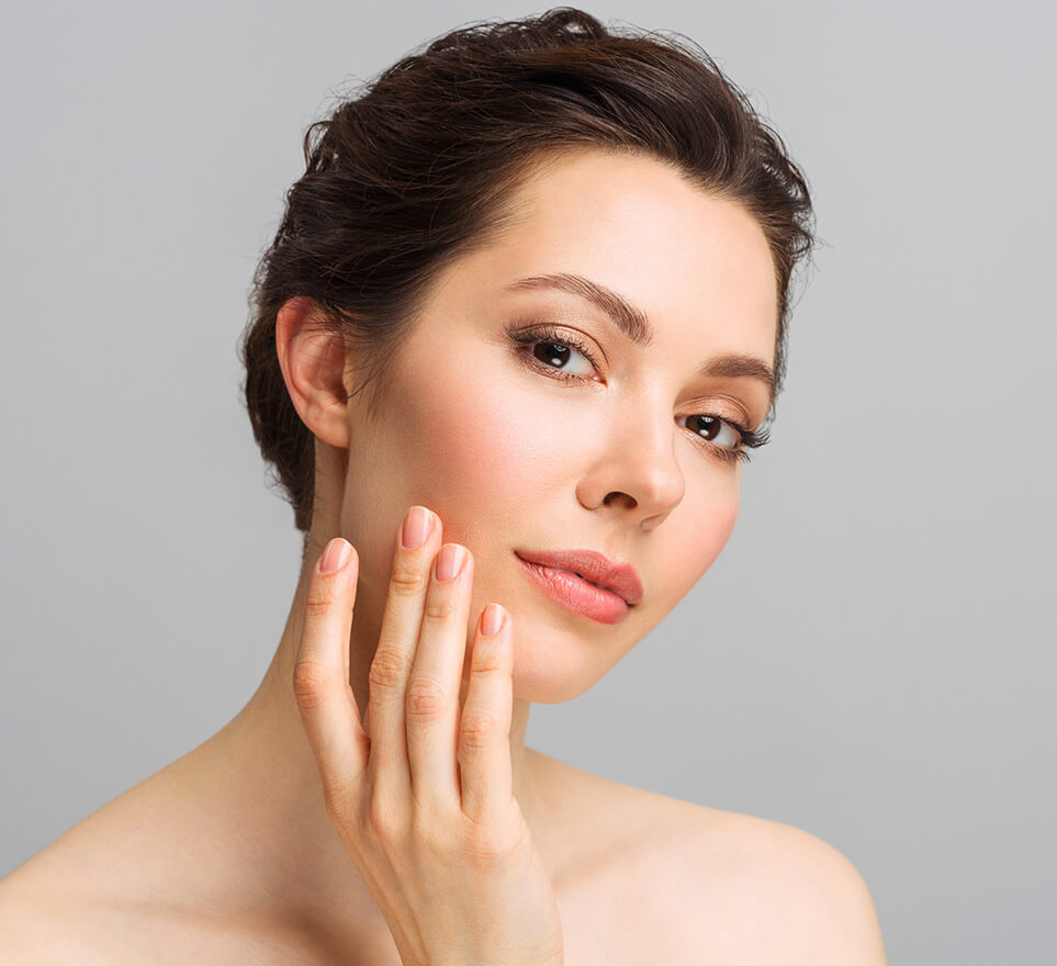 Beautiful woman touching her face