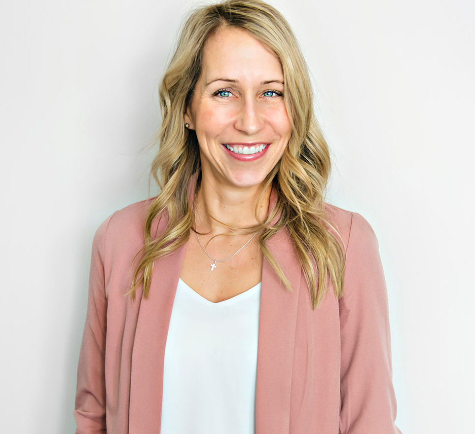 Blonde haired woman in peach coat