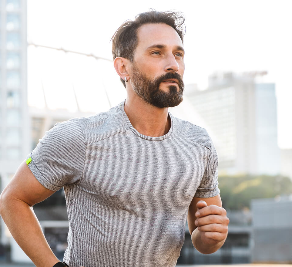 Fit mature man jogging